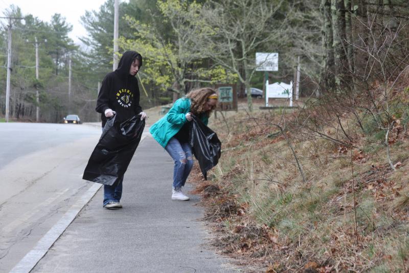 Wareham High School Key Club members Alana Nicoletti, right, and Ava Sullivan participate in the town-wide trash clean up held on Saturday. BY MATTHEW BERNAT